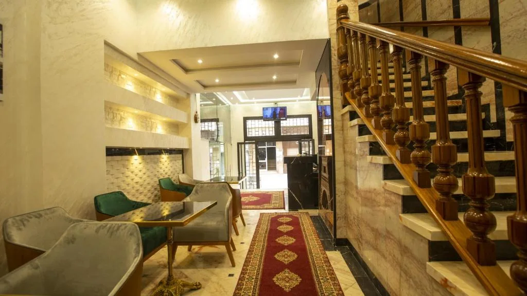 Lobby staircase and seating at Hôtel De Paris Casablanca